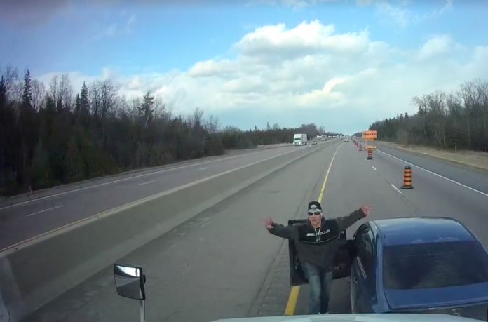 VIDEO: Infuriating car driver cuts off truck, then gets out to confront trucker