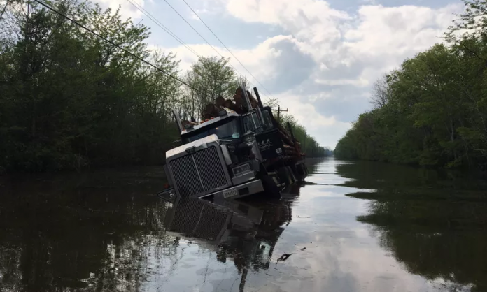 Deputies rescue truck driver stranded on flooded roadway