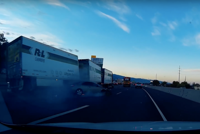 VIDEO: Car fleeing Utah troopers partially topples truck hauling triple trailers