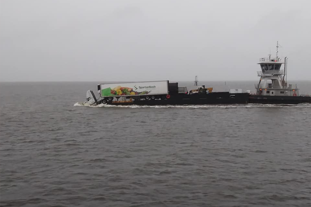 Semi truck partially falls off freight barge