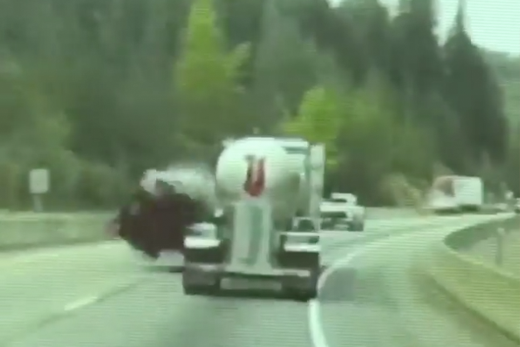 VIDEO: Car rolls after it clips tanker on Fourth of July Pass