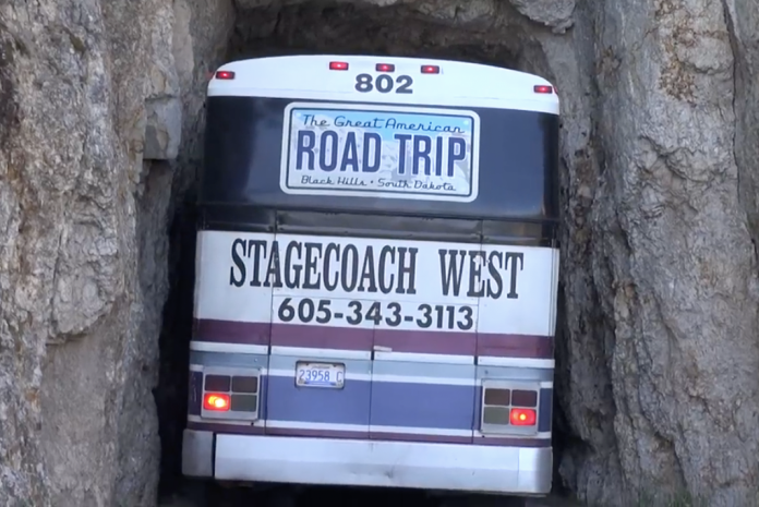 VIDEO- Impressive tour bus driver threads the Needles Highway in South Dakota