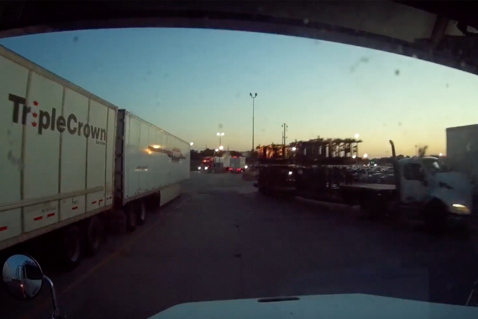 VIDEO: Truck hits parked trailer head on