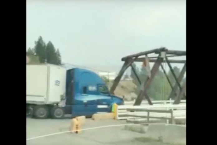 VIDEO- Truck takes on historic bridge. It does not go well.
