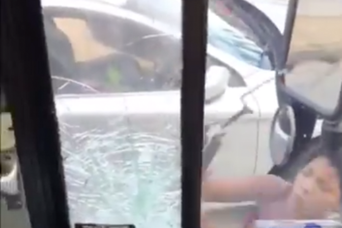Woman with the worst case of road rage we've ever seen rampages against a bus driver