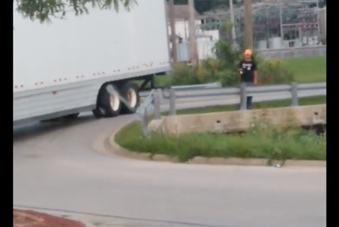 Truck driver caught on camera parking in the road to go fishing