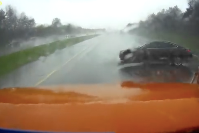 VIDEO- Alert trucker makes nice save when car hydroplanes