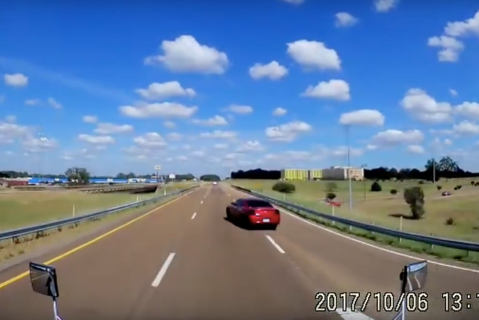 VIDEO- Dodge driver doesn't bother to look before merging in front of a semi truck, WCGW?