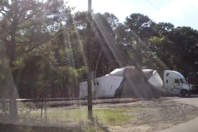 VIDEO: Freight train slices semi truck in half