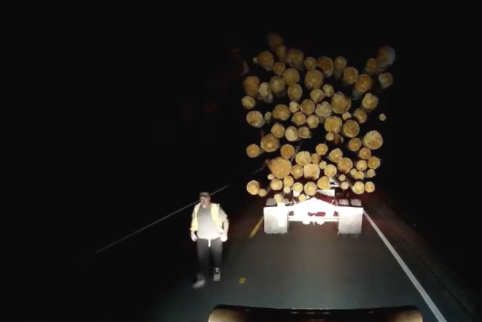 VIDEO- Log truck driver kicks the heck out of another driver's truck