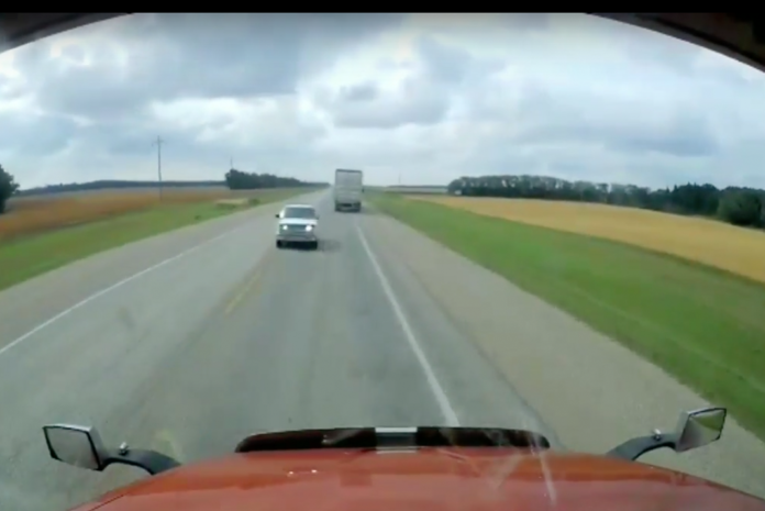 VIDEO: Oncoming car forces two semi trucks off the road