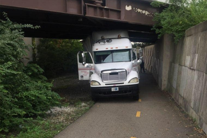 Trucker mistakes bike path for highway ramp, hits bridge