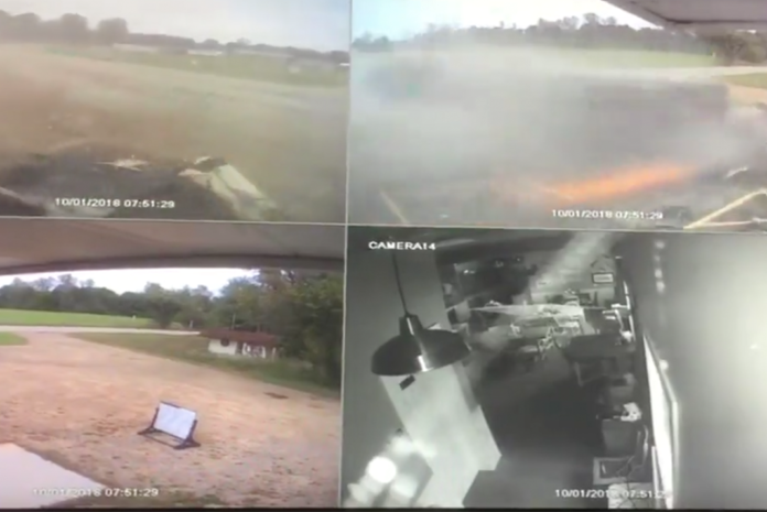 VIDEO: Scrap metal hauler overturns, sends sparks flying in parking lot