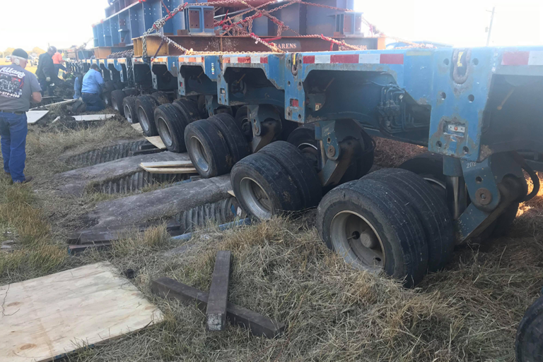 Two million pound load gets stuck in ditch, shutting down highway for a ...