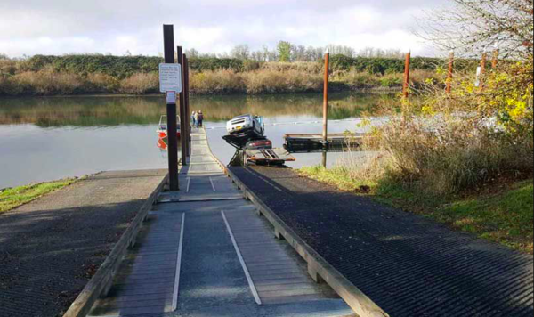 A car hauler had a rough morning yesterday that began when his truck got stuck on a set of railroad tracks and ended hours later when his truck was fished out of a nearby lake.