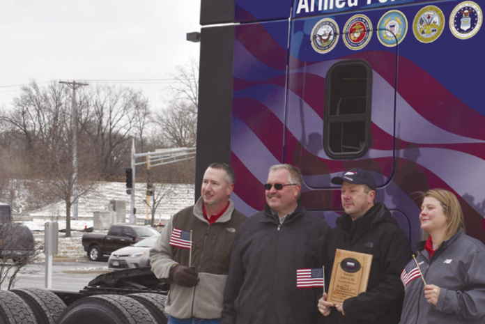 Trucking company honors driver with custom-designed truck to commemorate military service