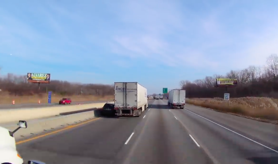 SUV driver ignores lane end sign, tries to squeeze past truck. It doesn ...