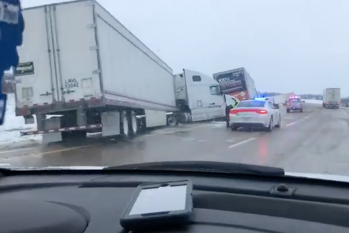 Flash freezing causes eleven semis to slide off the highway