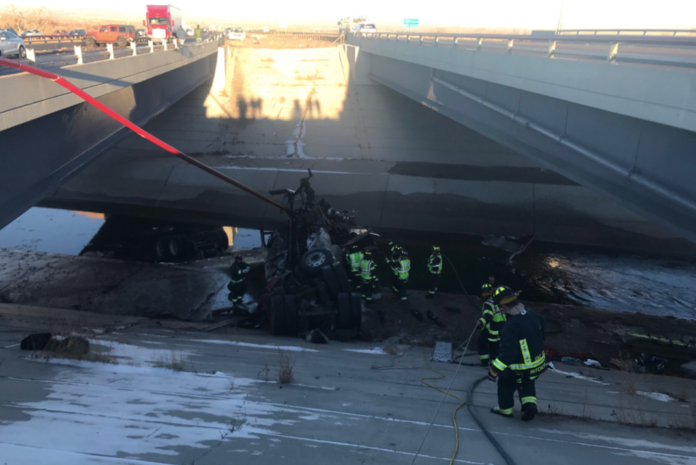 Multi-vehicle wreck sends semi crashing off overpass into ravine