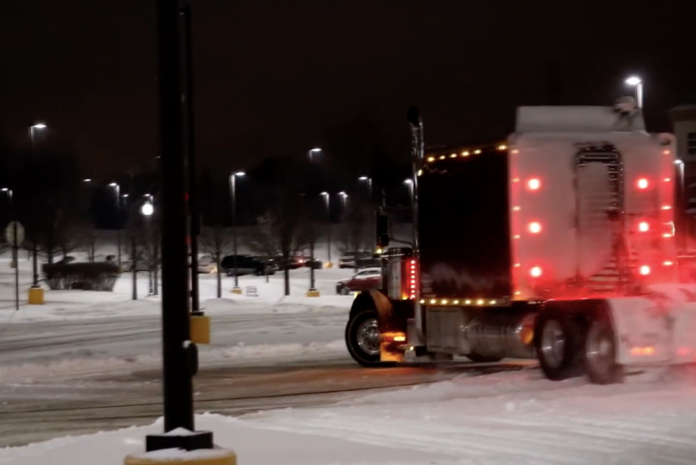 Trucker takes very expensive custom rig for a romp in the snow