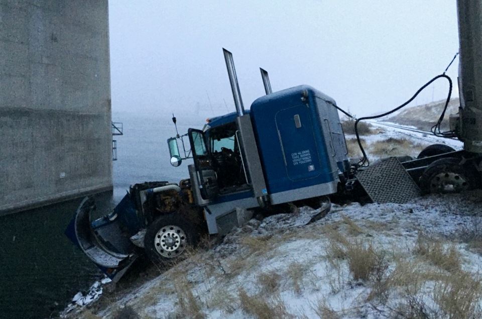 Cattle truck almost ends up in river after driver swerves to avoid skidding car