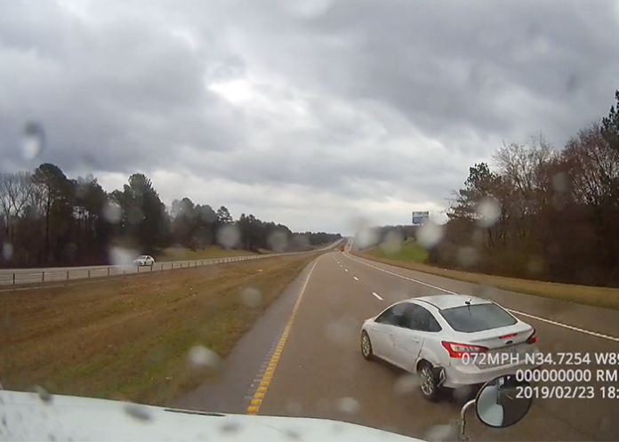 Trucker makes a serious save after a car runs him off the road