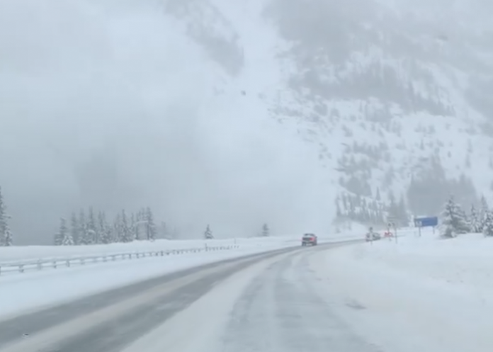 Moment that massive avalanche hurtles toward interstate caught on camera