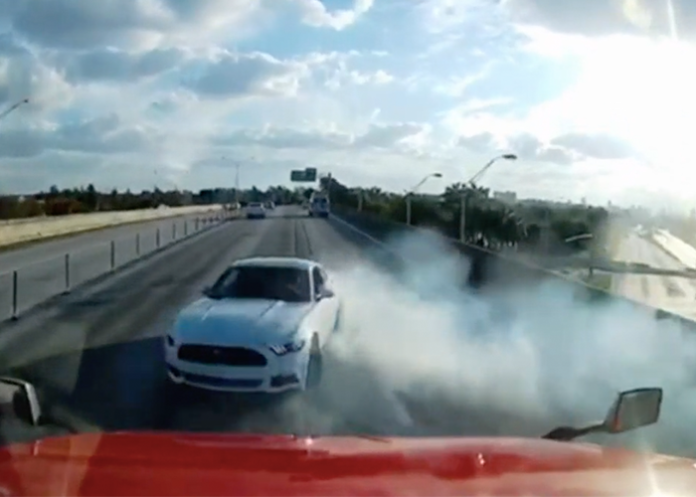 Out of control Mustang spins into semi truck, flees the scene