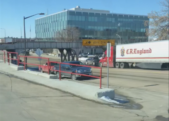 Trucker ignores multiple signs, flashing lights, hits bridge