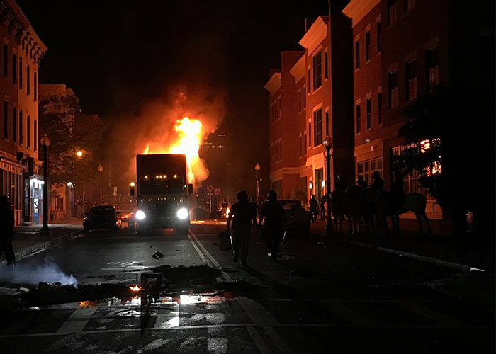 Man arrested for setting semi trailer on fire during protest