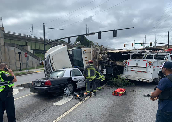 Dash cam captures truck tipping over on top of cop car in Georgia