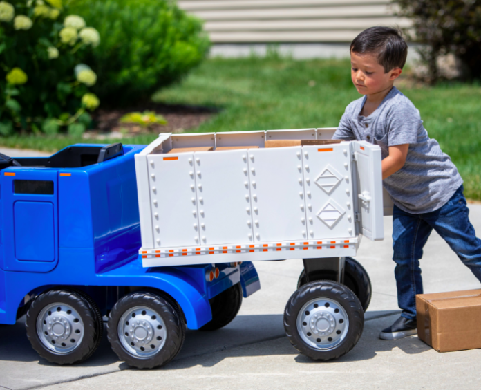 This rideable toy semi truck has a 'CB' and a detachable trailer and