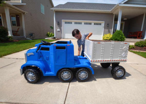 This rideable toy semi truck has a ‘CB’ and a detachable trailer and