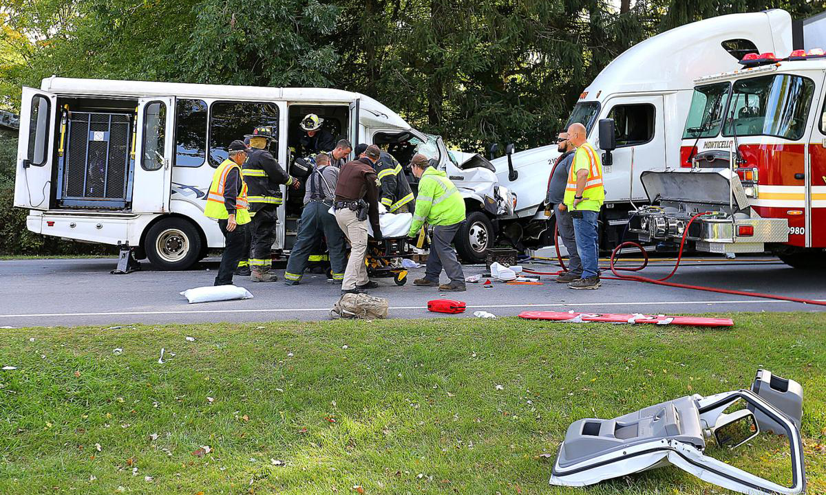 Passenger killed after bus crosses into path of oncoming semi truck