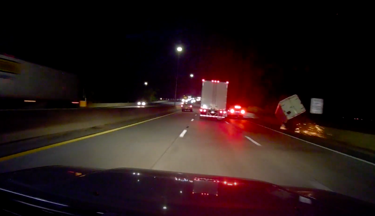 VIDEO: Car driving next to semi loses trailer in spectacular fashion