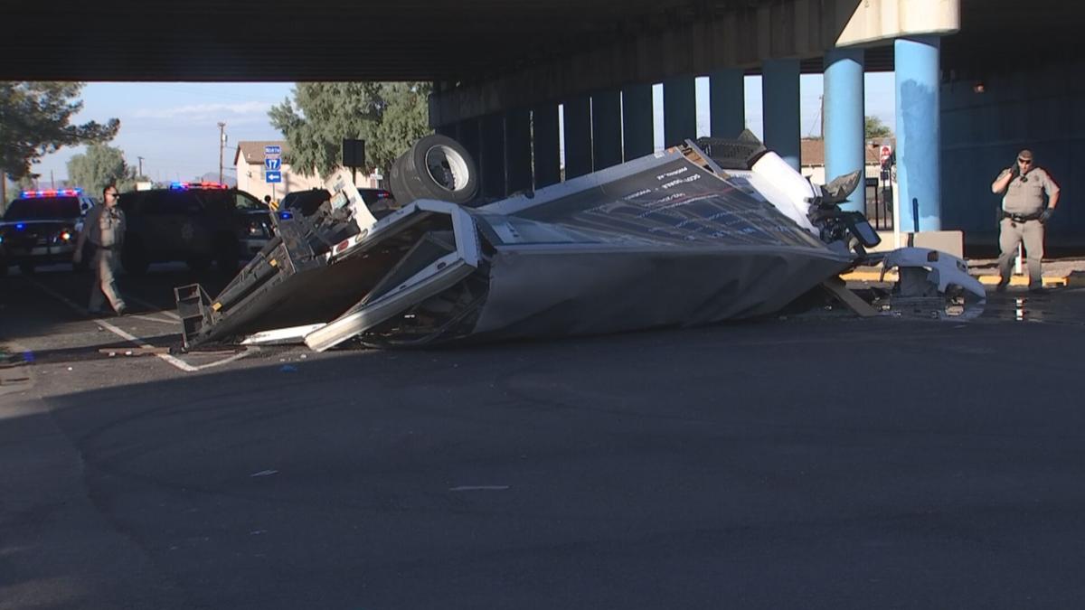 Driver, passenger walk away from truck that plummeted off interstate