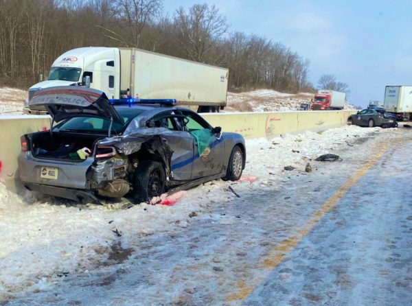 Trucker killed in crash after losing control and injuring troopers