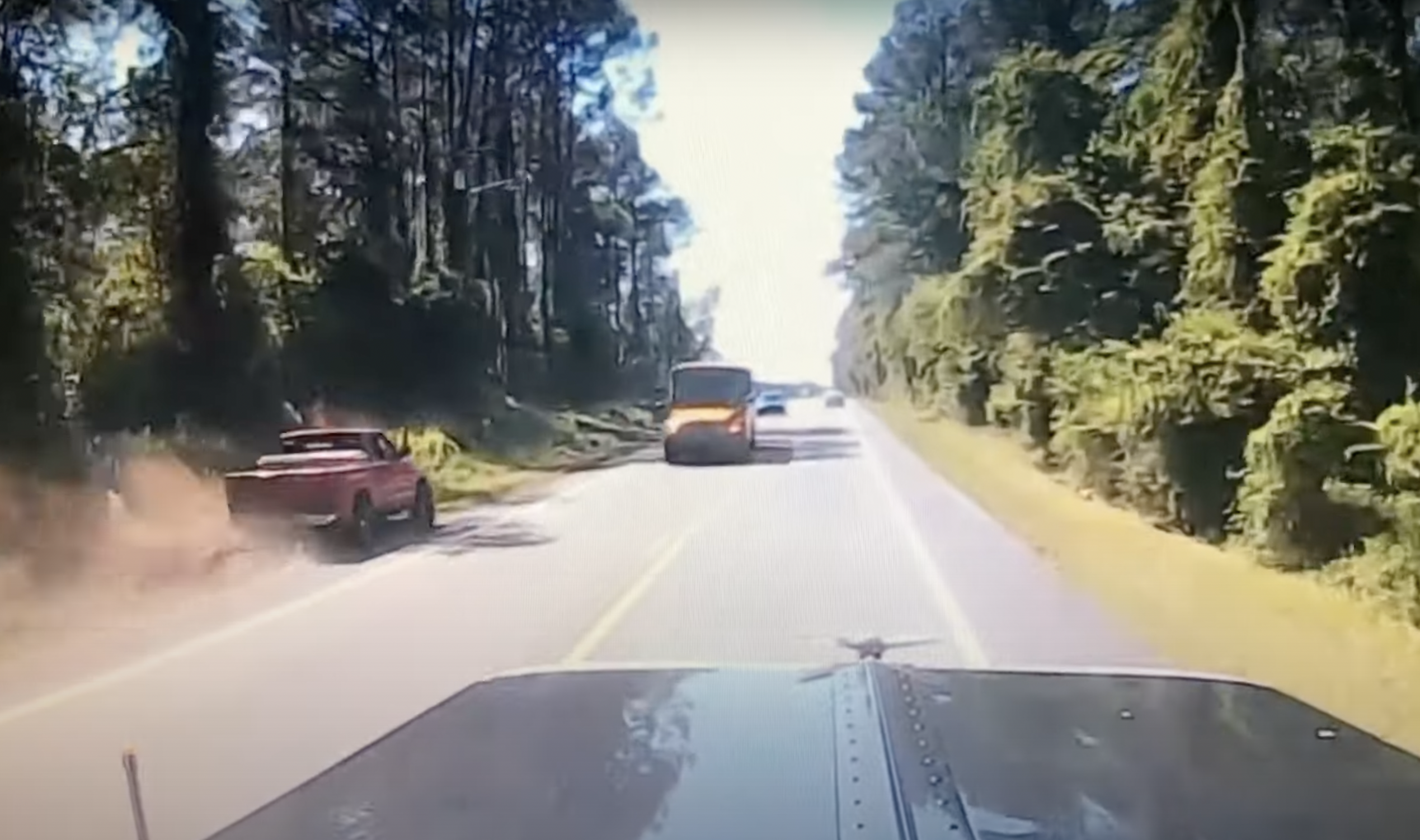 VIDEO: Pickup driver tries to pass log truck on left shoulder. It does not go well.