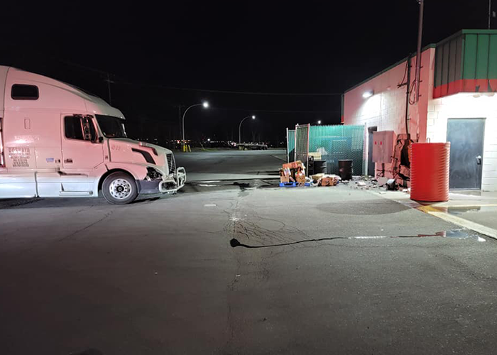 This driver watched a big rig roll by, slam into truck stop