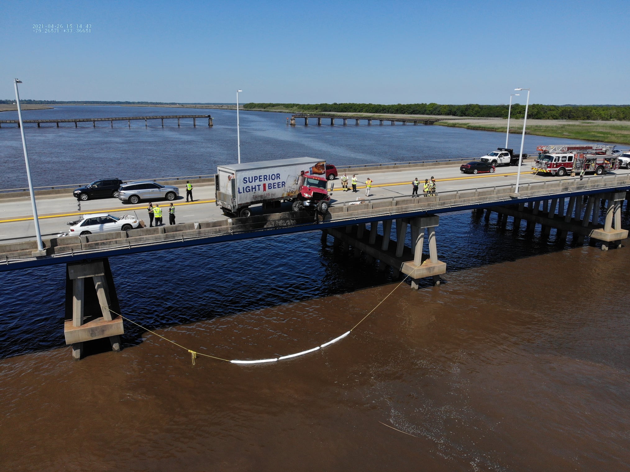 Trucker makes it out of semi left hanging off of bridge