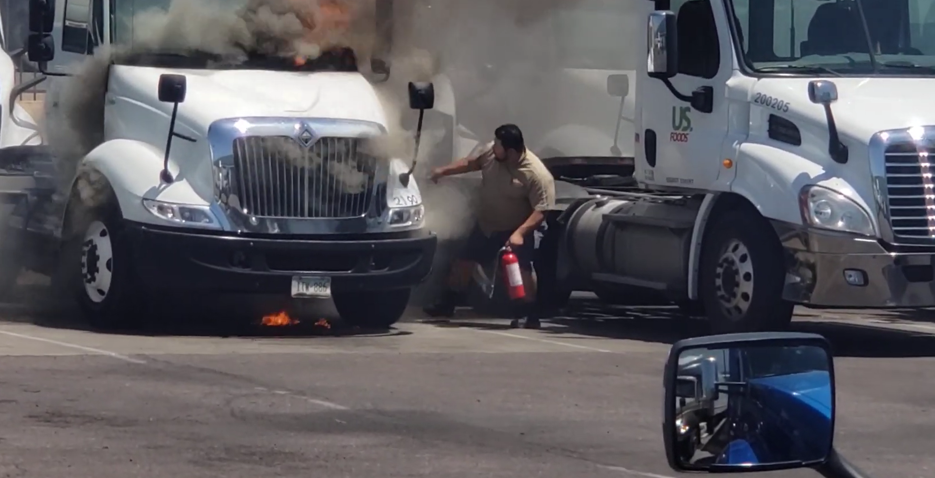 WATCH: Trucker does his best to save a rig going up in flames