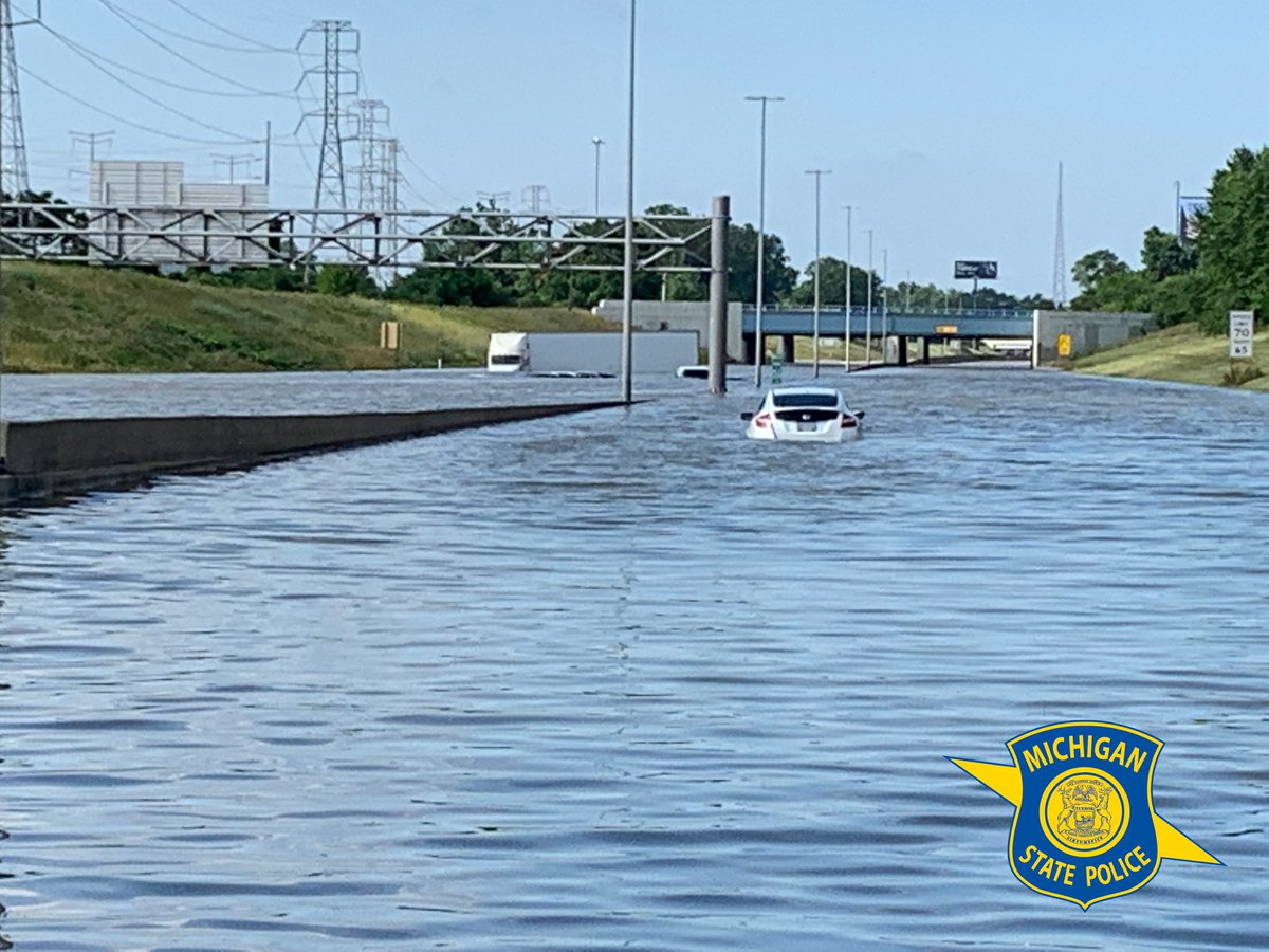 Flood waters left dozens of semis stranded on I-94 in Detroit