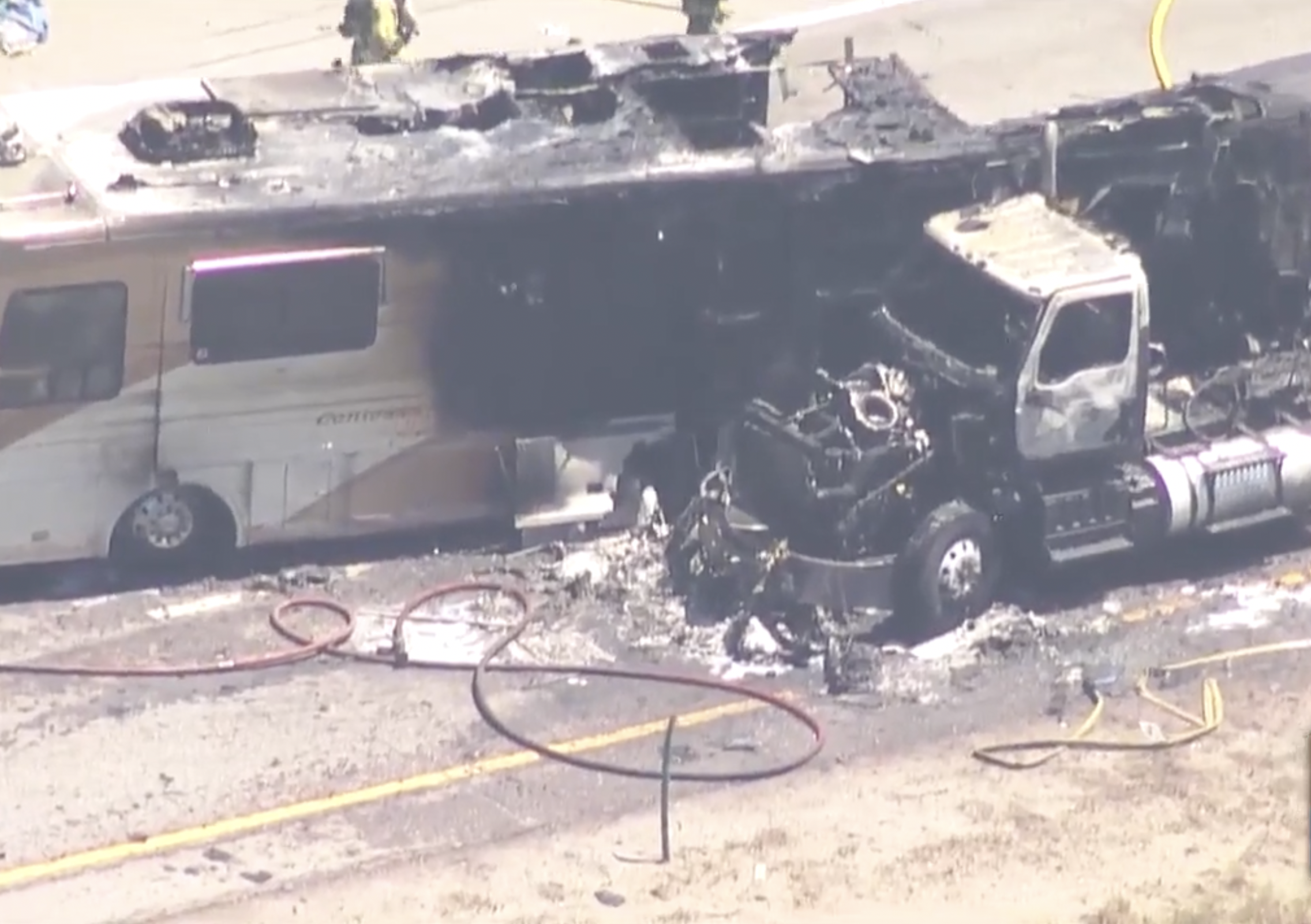 Burning RV rolled into a semi truck, shutting down I-70