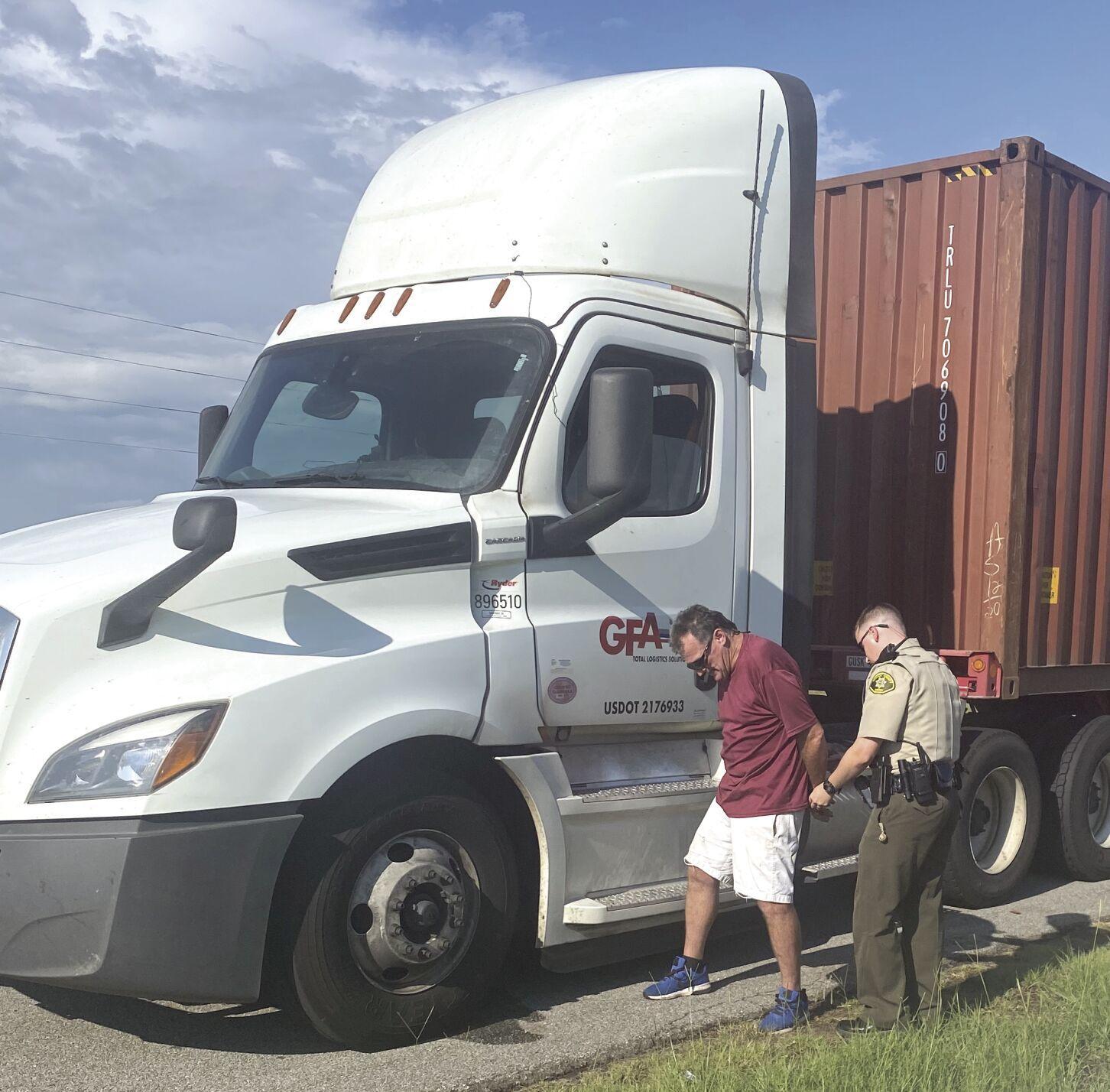 Trucker arrested after stopping in peach orchard to pee