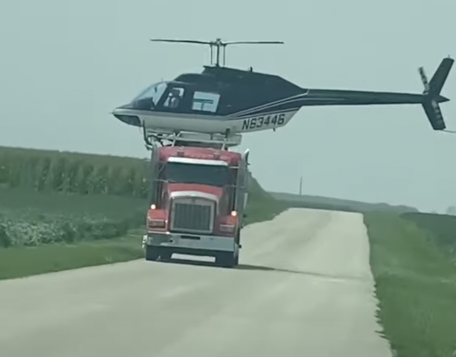 watch-as-a-helicopter-pilot-maneuvers-to-land-on-top-of-a-semi-truck