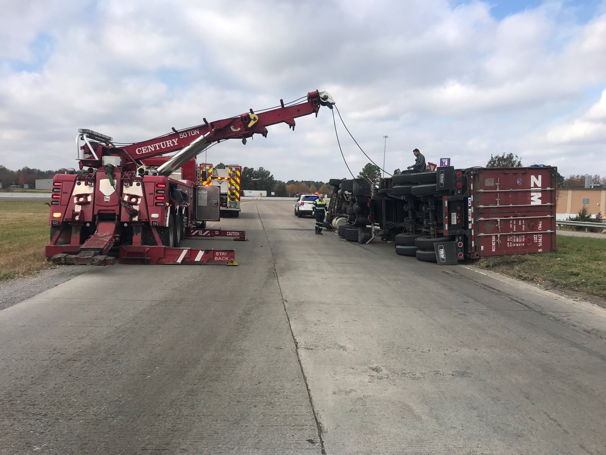 Police say load shift caused truck hauling $400K of Jack Daniels to overturn