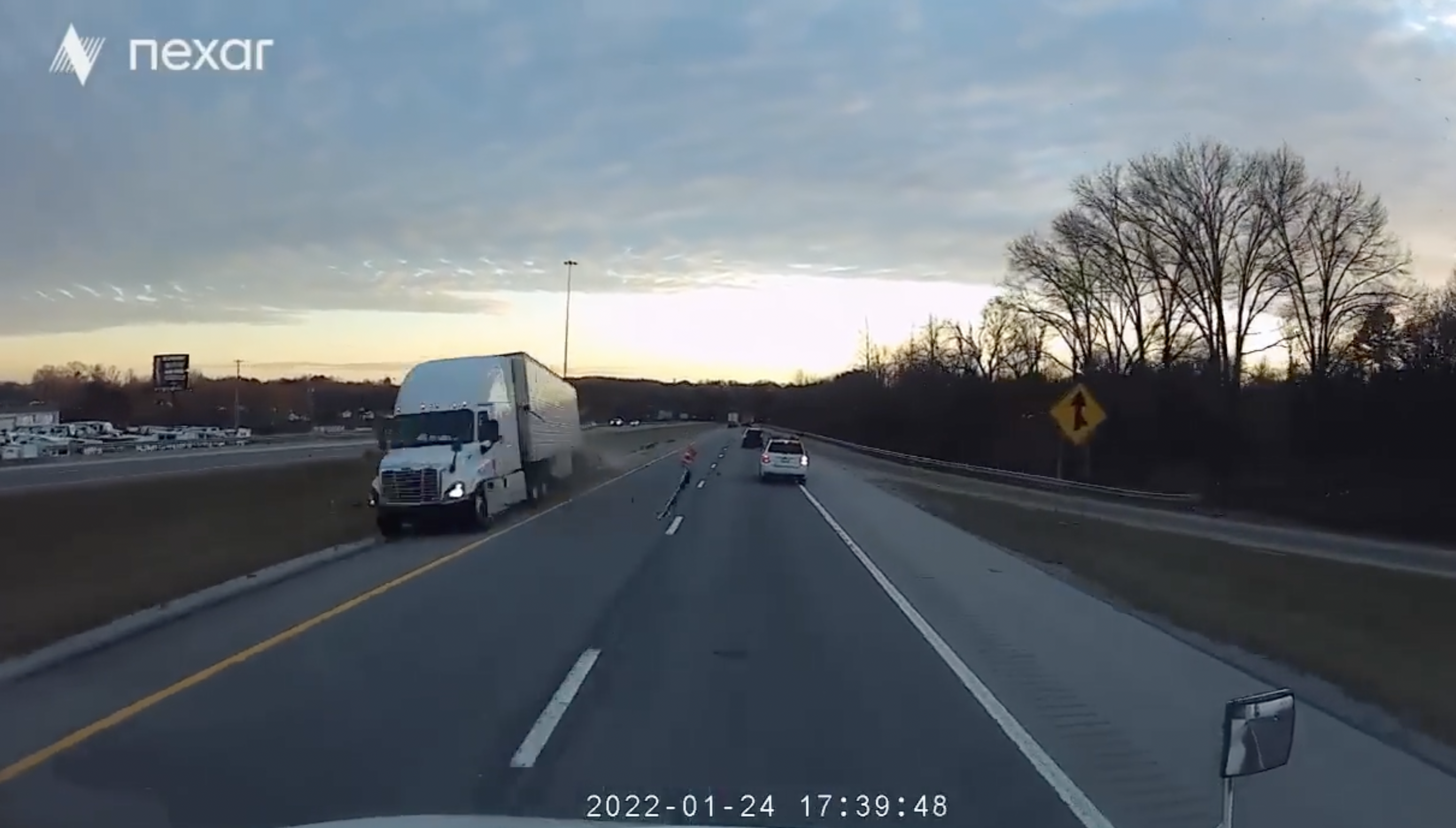 VIDEO: Trucker forced to think fast when a big rig barrels across the median