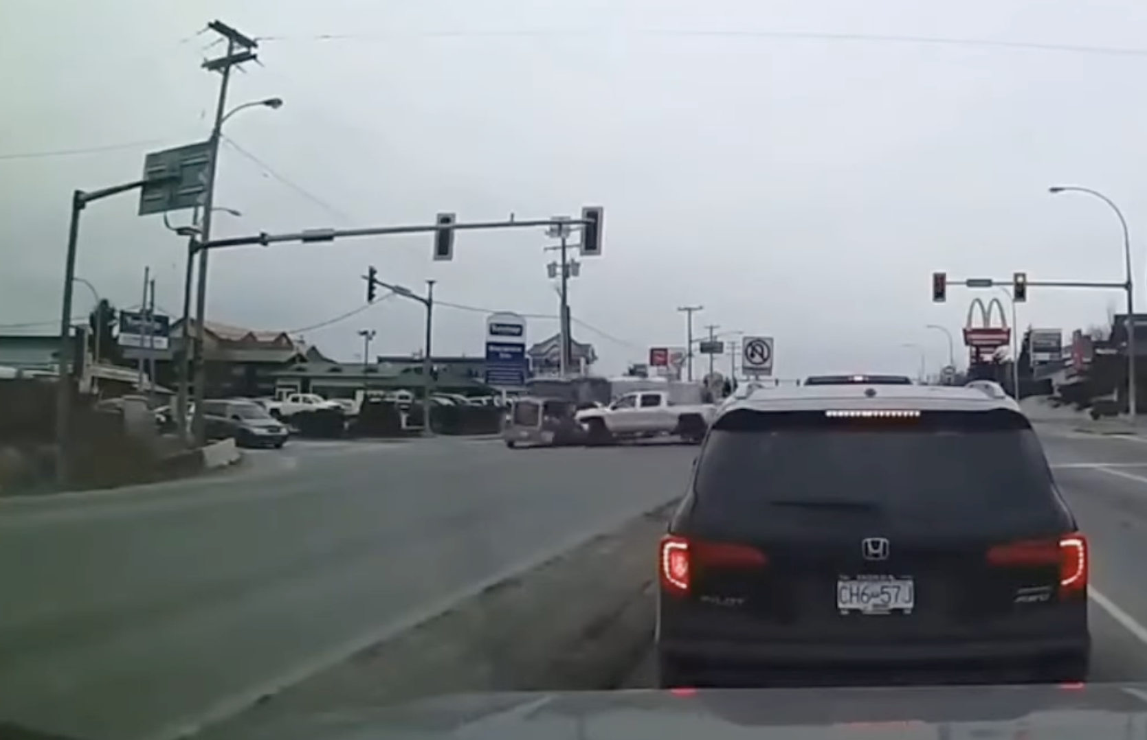 VIDEO: Pickup’s intersection mishap sends flatbed into stopped traffic