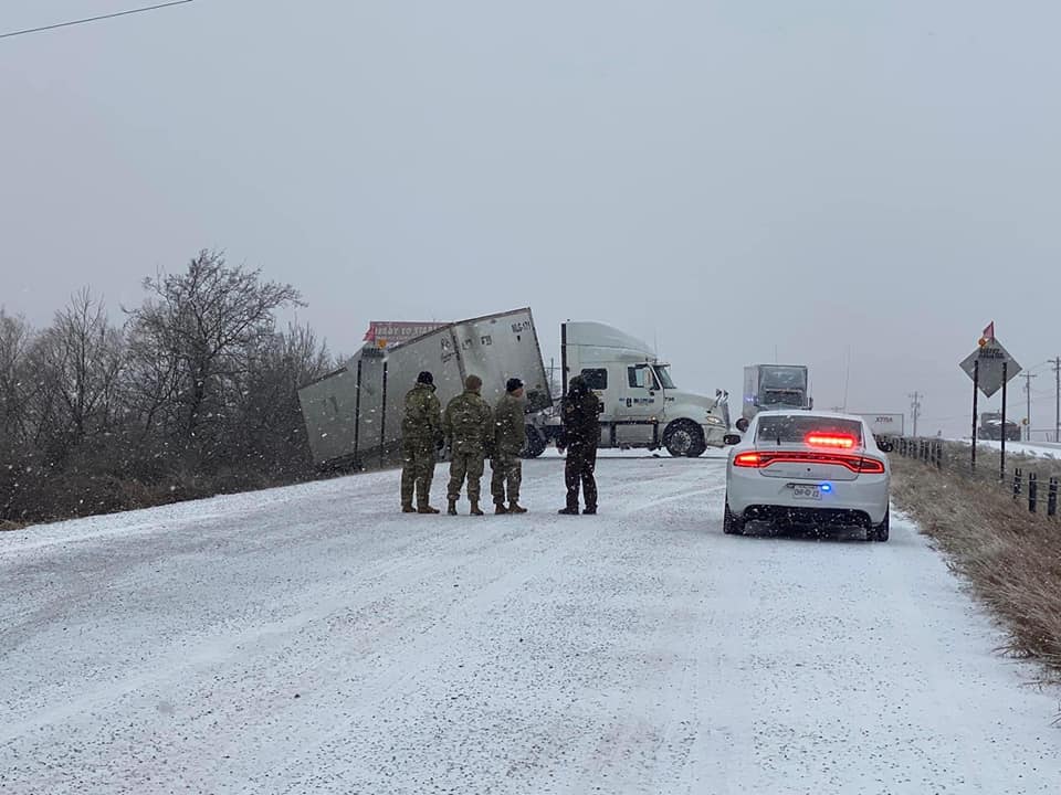 Oklahoma National Guard move in to stabilize semi that slid off the road