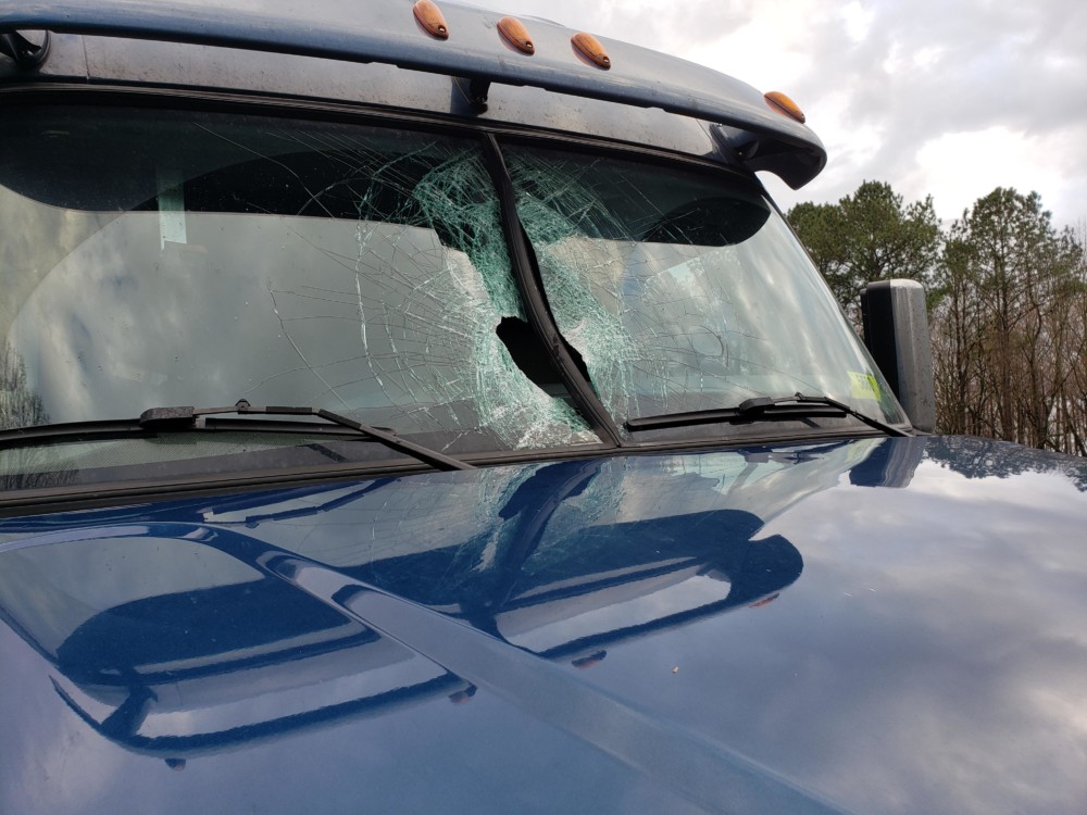 VIDEO: Concrete chunk shoots through windshield mere inches from driver ...